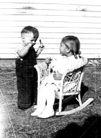 1940 ? Charles and Doris Fisher (sitting in wicker rocker)