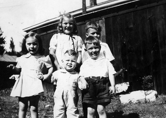 1942 ? Frances Meade, Doris and Charles Fisher in back, Jerry and A. B. Fisher in front.